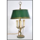 A Louis XVI Bouillotte four light candleabra coaching lamp on a round base with a green tole shade