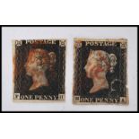 Two 19th century Victorian Penny Black stamps featuring the bust of Queen Victoria facing to the