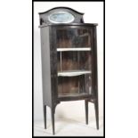 A 19th Century freestanding bow fronted ebonised pedestal  display cabinet, single bow fronted