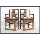 A pair of Chinese walnut elbow Chairs ( armchairs ) with pierced and carved splats with bat