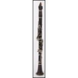 A vintage early 20th Century Buffet Compton & Co rosewood clarinet, with nickel plated keys and