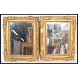 A pair of 20th century contemporary carved rectangular gilt wooden Florentine framed mirrors