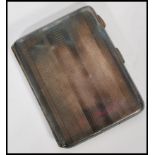 A Sterling Silver machine turned cheroot / cigarette case, the hinged case with geometric machine