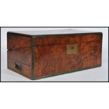A 19th century Georgian walnut and brass bound writing slope box. Hinged centre with open interior (