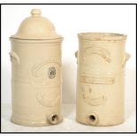 2 Victorian large ceramic water filters of cylindrical form to include a Howells Improved Water