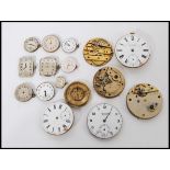 A group of vintage early 20th century pocket watch faces and movements to include J G Graves,