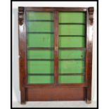 A 19th century Victorian mahogany chemists / shop Apothecary cabinet, fronted by two full length