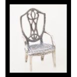 A stamped 925 silver miniature chair. Weight 3.5g.
