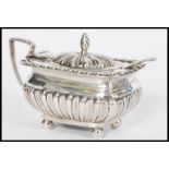 A 19th century Victorian silver hallmarked mustard pot condiment salt raised on bun feet with reeded