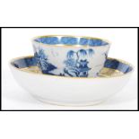 An early 19th century Chinese blue and white tea bowl with matching saucer the central cartouche