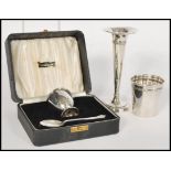 A group of silver items to include a silver hallmarked cased eggcup by Viner's Ltd (Emile Viner) and