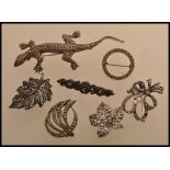 A selection of vintage 20th century silver white metal and marcasite brooches to include a brooch in