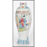 An early 20th century Chinese vase of bottle shape having cartouche panels depicting domestic