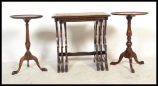 A pair of Georgian revival mahogany tripod wine tables with circular tops and splayed leg bases