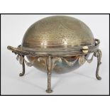 A late Victorian 19th Century silver plate muffin warmer raised on four legs with scrolled feet,