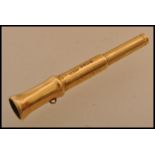 A hallmarked 18ct gold propelling pencil in the form of a telescope by S Mordan and Co. Weighs 11.