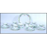 A vintage Aynsley English Fine Bone China six person tea service having floral decoration. Reg No