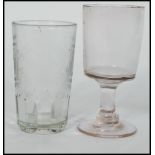 An 18th century Georgian wine rummer glass raised on a circular foot with hollow stem along with