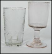 An 18th century Georgian wine rummer glass raised on a circular foot with hollow stem along with