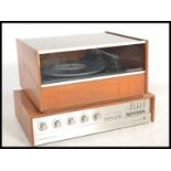 A retro 1960's Ferguson teak wood record player and amp, the record player with inset Garrard deck