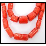 Two vintage large coral bead necklaces having graduating baroque coral beads with silver plated