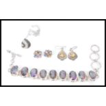 A selection of ladies contemporary jewellery to include a pair of silver drop earrings set with