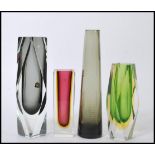 A group of vintage studio art glass to include a group of three tall square vases and a