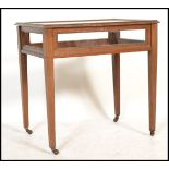 An Edwardian mahogany inlaid bijouterie table / display cabinet. Raised on square tapered legs