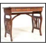 A 19th Century folding mahogany table / desk having metamorphic shaped supports, possibly