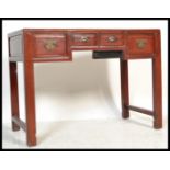 A 20th Century Chinese red lacquered elm alter / side table, four drawers to the front with fitted