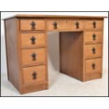 An antique Georgian style oak twin pedestal office desk in the manner of Old Charm / Jaycee. The