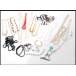 A selection of vintage costume jewellery to include rhinestone necklaces and bracelets, an art