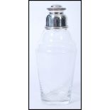 A vintage 20th century silver plated lidded glass cocktail shaker. The conical tapered body with