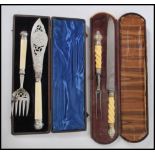 A 19th century Victorian cased carving set having ivory twist handles with silver plated mounts