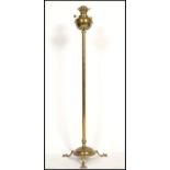 A 19th century Victorian Young's Central Draught standard oil lamp of brass construction. The