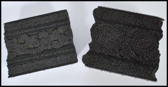 Two 19th Century wooden printing blocks,ornately carved, one having paisley carvings throughout