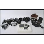 A collection of vintage cameras, lenses and accessories to include a Ross Ensign, Retina, Pentax,