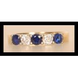 A hallmarked 18ct gold diamond and sapphire ring having alternating diamonds and sapphires. Approx