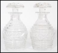 A pair of vintage 20th century cut glass crystal decanters of bulbous form complete with flat top