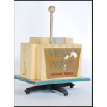 A stunning vintage 20th Century shop counter point of sale advertising dispenser for Venus Velvet