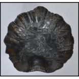 An early 20th century Japanese bronze / bronzed spelter bowl of scalloped form having relief