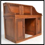 An unusual 19th century Victorian mahogany writing desk converted from a roll top desk having a