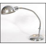 A vintage retro 20th century anglepoise type desk lamp raised on a circular base with adjustable
