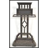 A 19th century Victorian Coalbrookdale style cast iron stick stand of architectural form having