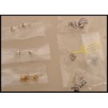 A selection of stud earrings to include a pair of stamped 925 silver vermeil earrings prong set with