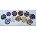 A selection of vintage mid 20th century compacts to include a selection of Stratton examples