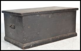 A Victorian 19th century ebonised pine blanket box chest being raised on plinth base with panel