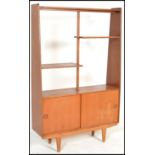 A vintage / retro 20th Century teak wood room divider bookcase / upright cabinet. Raised on shaped