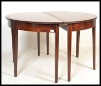 A pair of 19th Century George III mahogany console / D-end tables, the Demi Lune tables raised on
