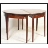 A pair of 19th Century George III mahogany console / D-end tables, the Demi Lune tables raised on